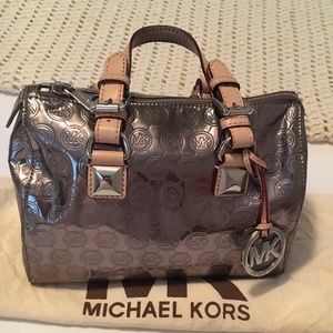Michael Kors monogram mirror metallic Grayson bag.